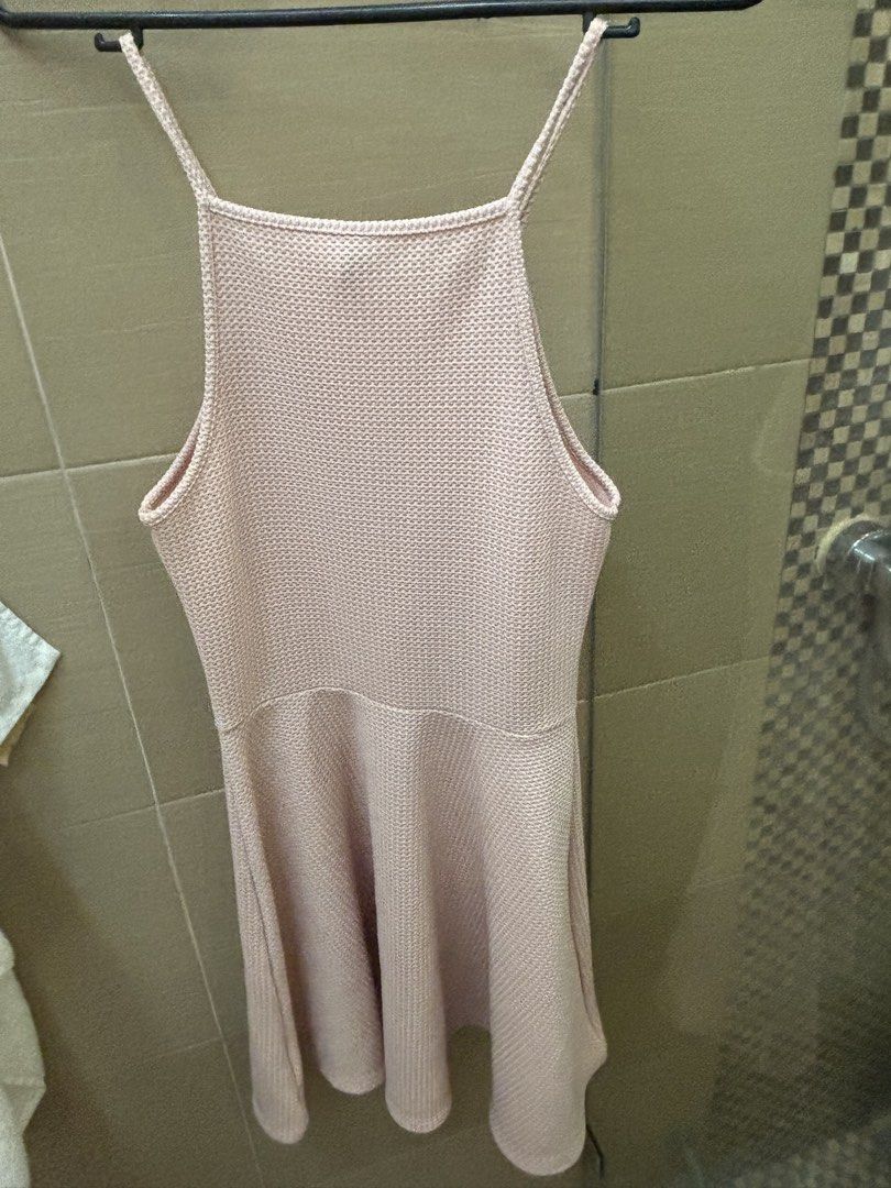 H&M Divided Pink Spaghetti Strap Dress (Category: Dresses) located in Caloocan City. Submitted by wildbird_086d1b (Listing ID 1467972495, Image 3). Description: - Brand: H&M Divided - Color: Pink - Size: EUR 36 / US 6 - Material: Textured knit fabric - Design: Square neckline, thin straps, fitted waist, and skater skirt - Condition: Great basic piece - Styling: Easy to dress up for nights out or down for casual days.