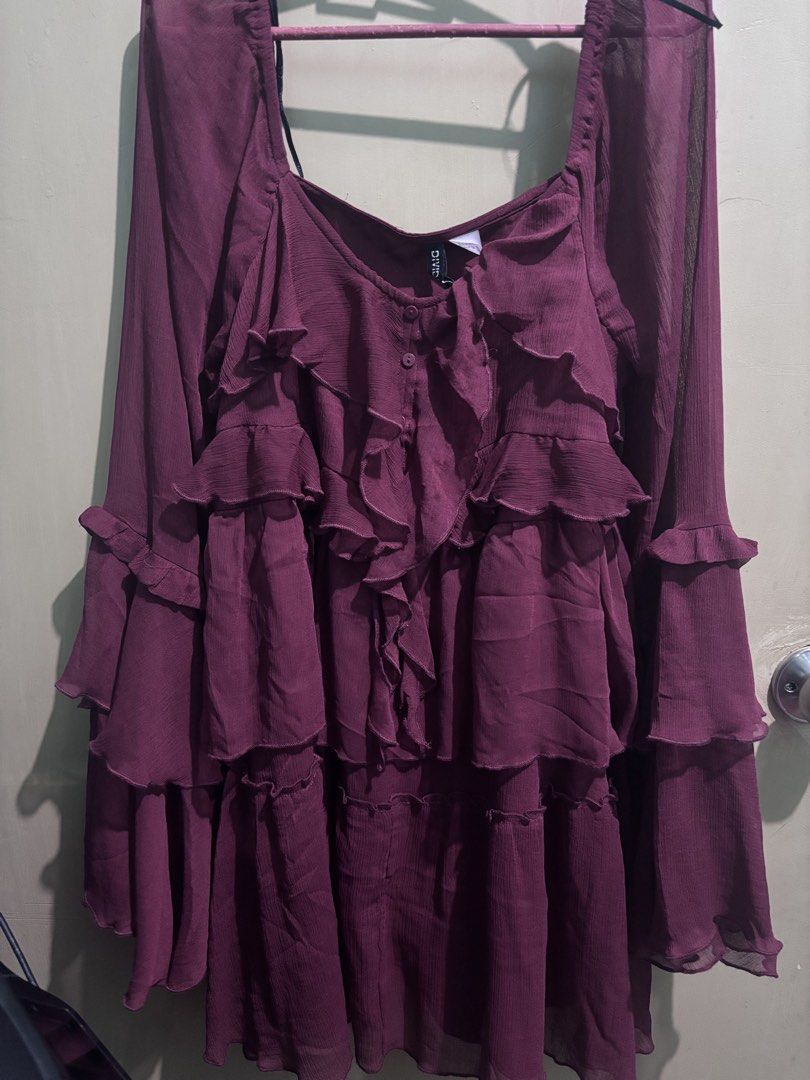 H&M short dress long sleeves (Category: Dresses) located in Quezon City. Submitted by juiriya (Listing ID 1467892521, Image 1). Description: - Brand: H&M Divided - Style: Ruffle tiered dress with square neckline - Sleeves: Long bell sleeves with layered ruffles - Details: Lightweight semi-sheer fabric with button front near neckline - Colors: Burgundy - Size: burgandy: 38 EUR - Occasion: Great for casual outings or parties - Condition: Brand new 