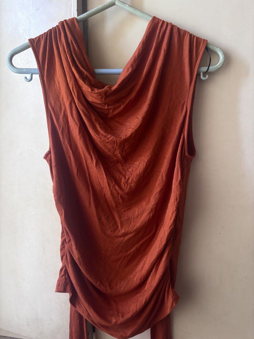 H&M Rust Red Cowl Neck Sleeveless Top (Category: Sleeveless) located in Bacoor. Submitted by fmax19 (Listing ID 1467892263, Image 1). Description: - Brand: H&M - Color: Rust Red - Size: S (tag) - Condition: Brand new, never worn with original PHP 799 store tag attached - Material: Soft and stretchy fabric - Details: Draped cowl neckline and flattering gathered side details.