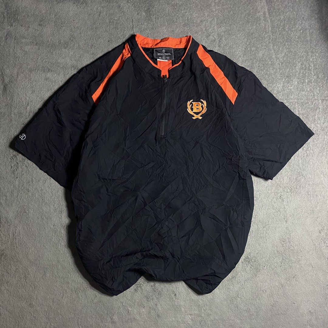 Holloway Black Orange Short Sleeve Pullover Size XXL (Category: Coats, Jackets and Outerwear) located in Manila. Submitted by thrifturfit_star (Listing ID 1467862744, Image 1). Description: - Brand: Holloway - Color: Black with orange accent panels - Size: XXL - Style: Short-sleeve half-zip pullover jacket / windbreaker - Details: Embroidered 'B' logo on left chest - Condition: Clean, excellent, and ready to wear.
