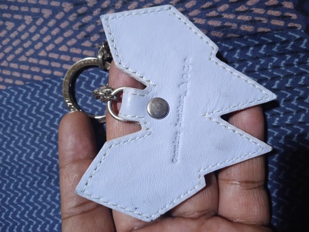 Hoze Genuine Leather Metal Studded Keychain Silver Light Blue (Category: Charms) located in Davao. Submitted by thefrugalshop (Listing ID 1467995321, Image 3). Description: - Brand: Hozé - Material: Genuine leather in light blue with silver hardware - Design: Pyramid metal studs on the front and embossed brand lettering on the back - Hardware: Chain link attachment with a sturdy split ring for keys - Condition: Clean with minimal wear on the hard