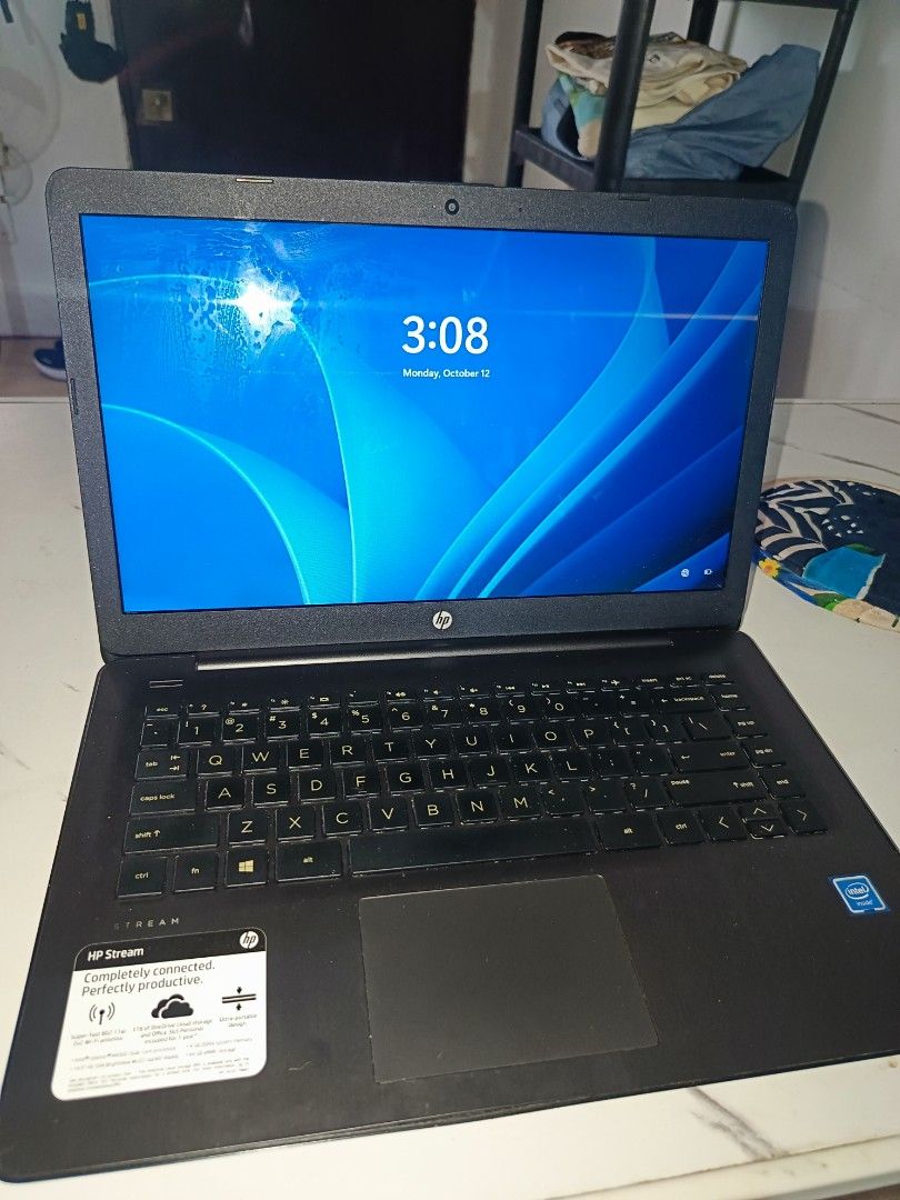 HP Stream Laptop Intel Celeron 4GB RAM Windows 11 (Category: Laptops & Notebooks) located in Valenzuela. Submitted by ichicadangan01 (Listing ID 1467988470, Image 2). Description: HP Stream laptop running Windows 11 Home. Powered by an Intel Celeron N4000 processor at 1.10GHz. Includes 4GB of installed RAM. Black chassis with the HP logo on the lid and palm rest sticker intact. Screen turns on normally. Great portable machine for everyday school 