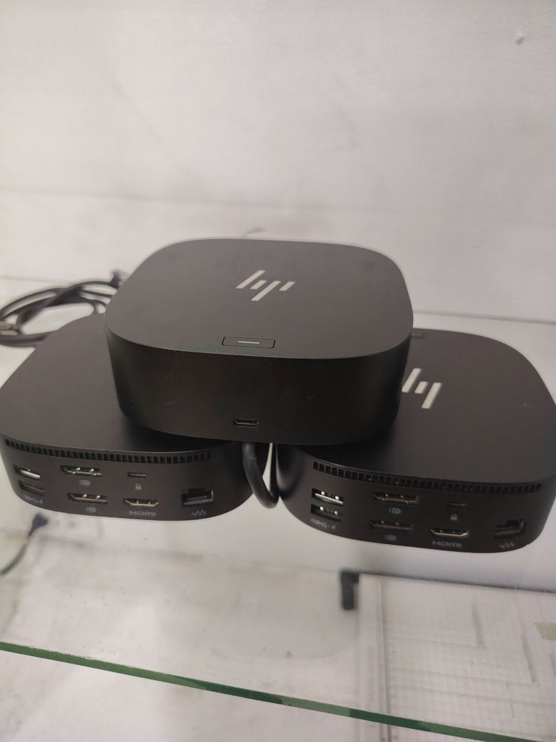 HP USB-C G5 Docking Station Hub (Category: Cables & Adaptors) located in Caloocan City. Submitted by pherxtotz (Listing ID 1467915203, Image 3). Description: - Model: HP G5 USB-C Docking Station - Color: Sleek black finish with silver HP logo - Ports: Dual DisplayPort, HDMI, USB-A, USB-C, and Ethernet jack - Includes attached power cable - Condition: Clean surfaces and well-maintained - Ideal for multi-monitor work-from-home or office setups.