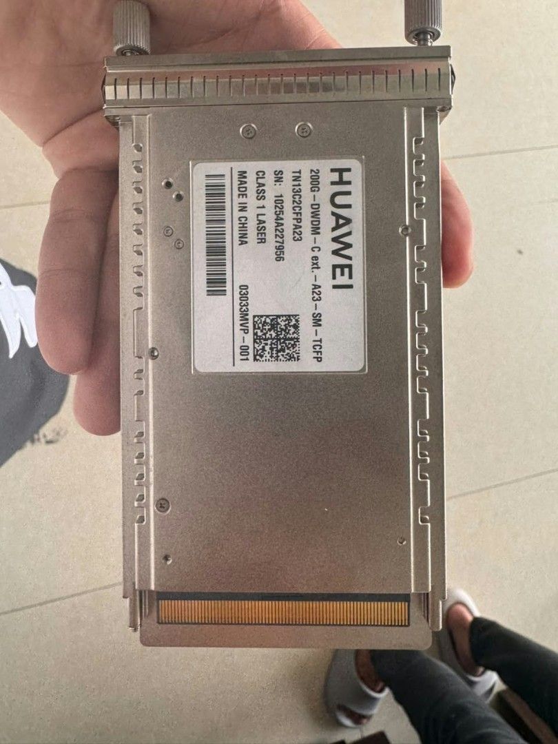 Huawei 200G DWDM Transceiver Module CFP2 (Category: Networking) located in Manila. Submitted by machristi54481 (Listing ID 1467842412, Image 1). Description: - Brand: Huawei - Models: TN13C2CFP23 and TN14C2CFP23 - Speed/Type: 200G DWDM optical transceiver modules - Condition: Pulled from working network environment, clean pins, ready for deployment - Compatibility: Suitable for compatible enterprise switches and routers - Safety: Class 1 laser eq