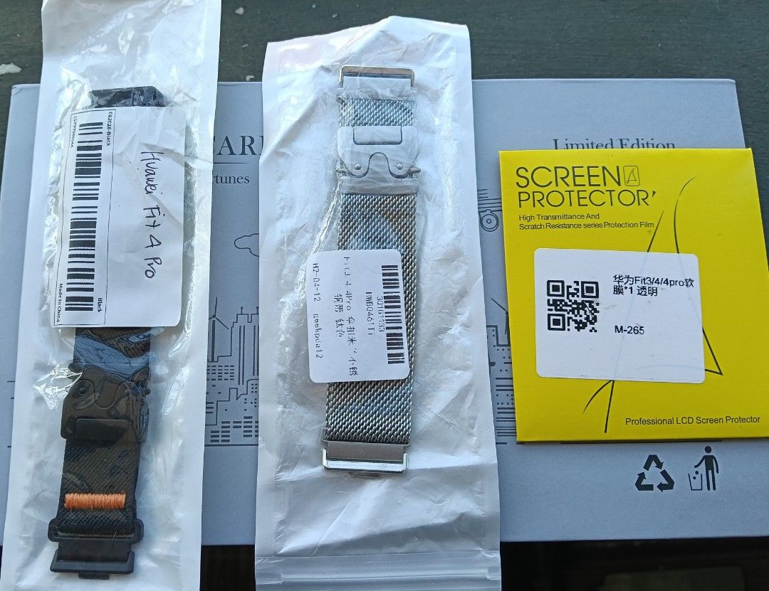 Huawei Fit 4 Pro watch straps and screen protector (Category: Wearables & Smart Watches) located in Dasmarinas. Submitted by arielvergano (Listing ID 1467914446, Image 2). Description: - Compatible with: Huawei Fit 4 Pro - What's included: 1x Black nylon strap with buckle, 1x Silver metal mesh Milanese loop band, 1x Clear screen protector film pack - Condition: Brand new, unused, and sealed in original plastic packaging - Style: Easily switch bet