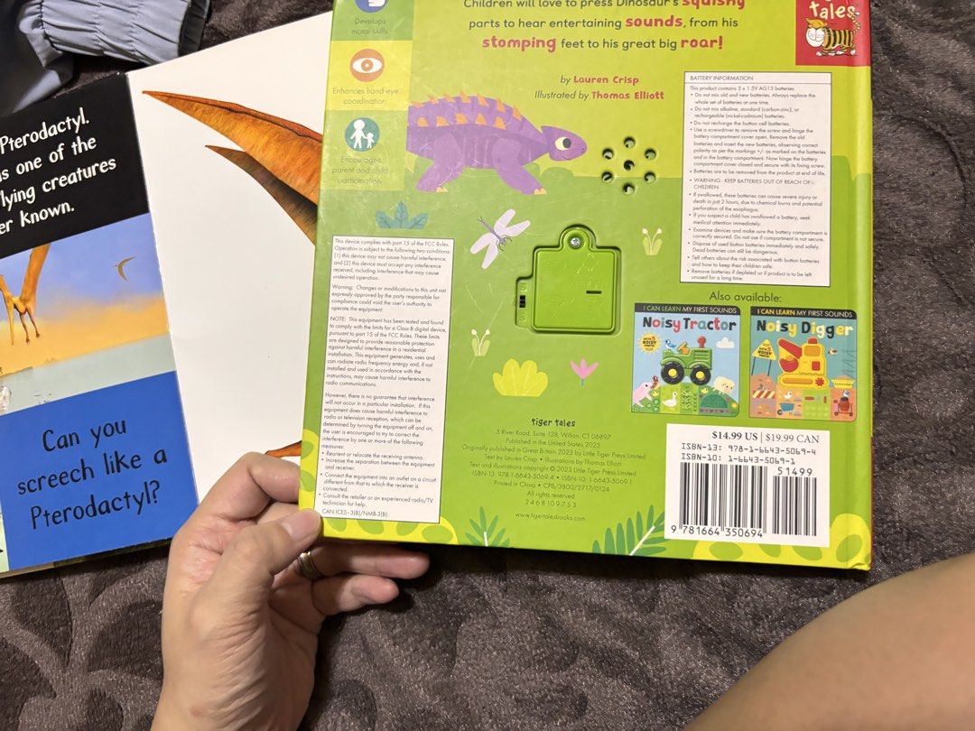 I Can Learn My First Sounds Noisy Dinosaur Book (Category: Children's Books) located in Cavite. Submitted by jiyoungdcruz30 (Listing ID 1468033914, Image 2). Description: - Title: Interactive Dinosaur Sound Book (Tiger Tales, 2023) - Authors: Written by Lauren Crisp, illustrated by Thomas Elliot - Features: Press the green dinosaur on the cover for fun roaring sounds - Practicality: Includes an on/off switch on the back cover - Battery: Uses 3 AG