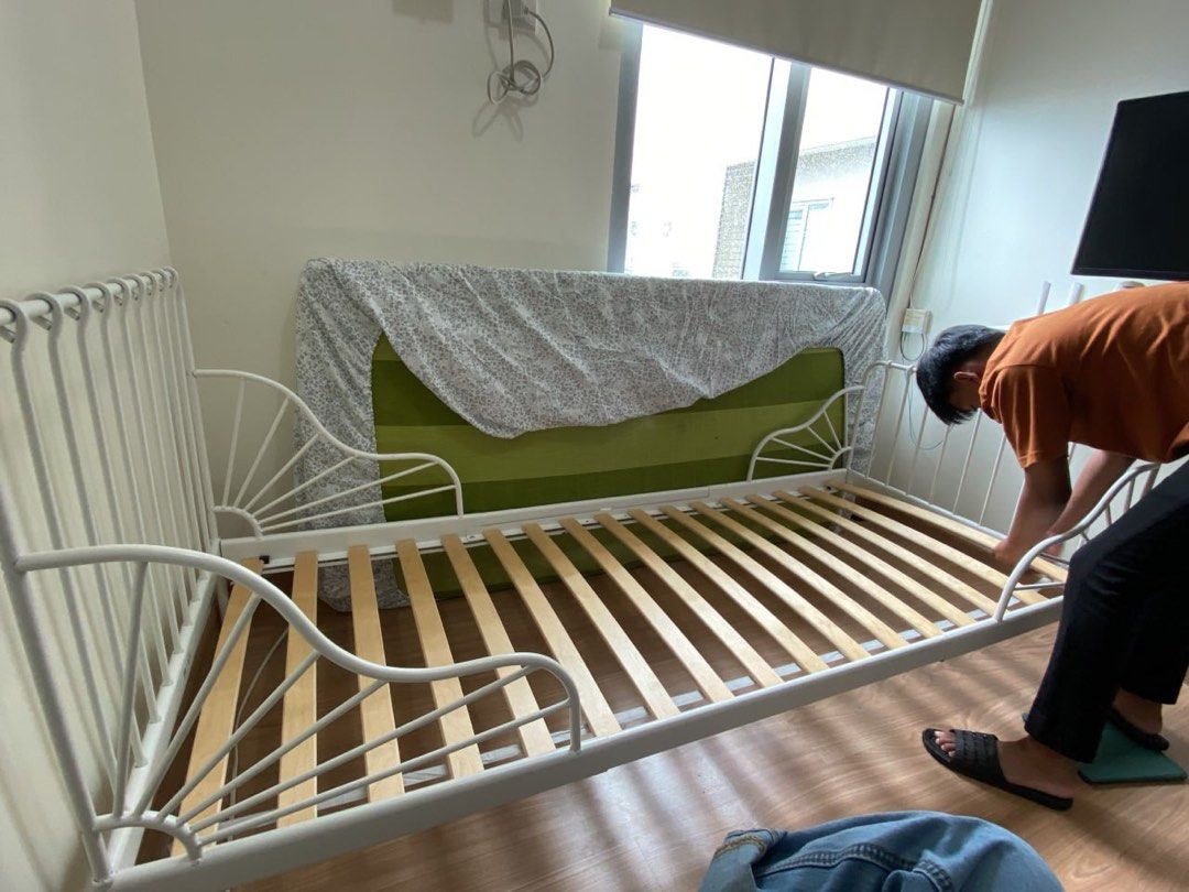IKEA Minnen Extendable Bed (Category: Bed Frames & Mattresses) located in Quezon City. Submitted by carla70424 (Listing ID 1467884854, Image 3). Description: - Color & Material: White steel frame with solid wooden slats - Growth-Friendly: Extendable design pulls out to different lengths as kids grow - Space Saver: Ideal for smaller bedrooms - Design: Classic spindle headboard with curved side rails Issues: One missing screw (check last photo) RFS