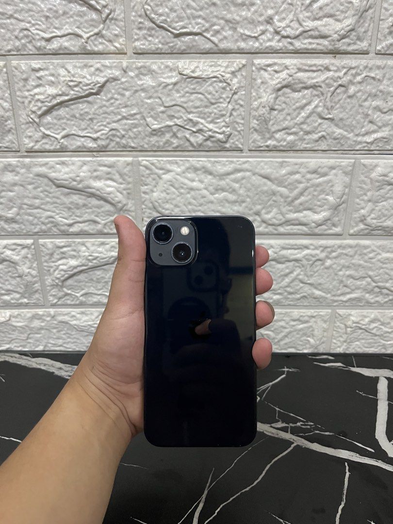 Iphone 13 128gb (Category: iPhone 13 Series) located in Quezon City. Submitted by bambsiphoneflip (Listing ID 1467934446, Image 2). Description: IPHONE 13 Midnight 128gb Face ID Working True Tone Working Factory Unlocked 85 batt health ZP/A Variant NTC Approved Issue: Dents see pics Inclusions: Unit, Case, Cord, Original box same imei ₱18,000 negotiable Pass sa barat Loc: Batasan Hills QC.