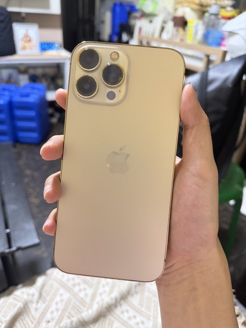 Iphone 13 Pro Max Gold 128gb (Category: iPhone 13 Series) located in Manila. Submitted by enticexx (Listing ID 1467975027, Image 1). Description: Iphone 13 Pro Max 128gb Gold Unit only - All orig parts -no history of repair - 70 bh - issues: camera lens ( di nakaka affect sa output/picture) .