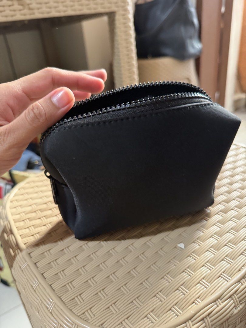 ISSY Phantom Black Makeup Pouch (Category: Purses & Pouches) located in Paranaque City. Submitted by mryjwll (Listing ID 1468057554, Image 2). Description: - Brand: ISSY - Color: Classic black with a sleek silver metallic logo - Material: Sturdy, durable build with a secure chunky top zipper - Storage: Clean and spacious interior, perfect for daily makeup and essentials - Design: Minimalist and compact, easy to toss into a tote or backpack - Cond