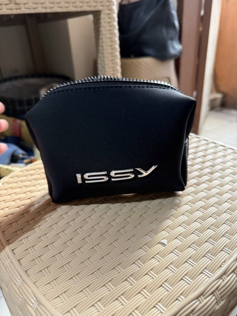 ISSY Phantom Black Makeup Pouch (Category: Purses & Pouches) located in Paranaque City. Submitted by mryjwll (Listing ID 1468057554, Image 1). Description: - Brand: ISSY - Color: Classic black with a sleek silver metallic logo - Material: Sturdy, durable build with a secure chunky top zipper - Storage: Clean and spacious interior, perfect for daily makeup and essentials - Design: Minimalist and compact, easy to toss into a tote or backpack - Cond