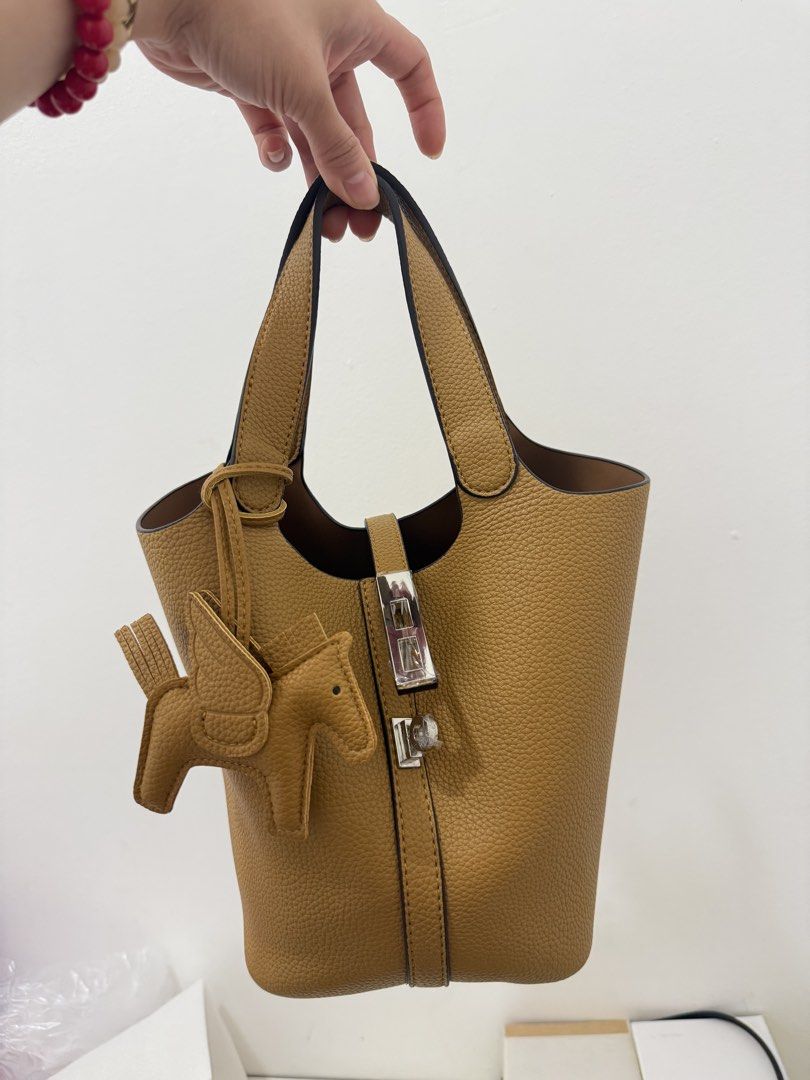 Japan Brand. Picotin Inspired (Category: Tote Bags) located in Angeles City. Submitted by bagpriceinfiniteluck (Listing ID 1467970532, Image 1). Description: Brandnew / unused ON HAND PH🇵🇭 Japan Brand Leather. Picotin H inspired. Pouch is removable as well as the rodeo charm. Super cute and nice in actual. Ready for shipping✨💫.