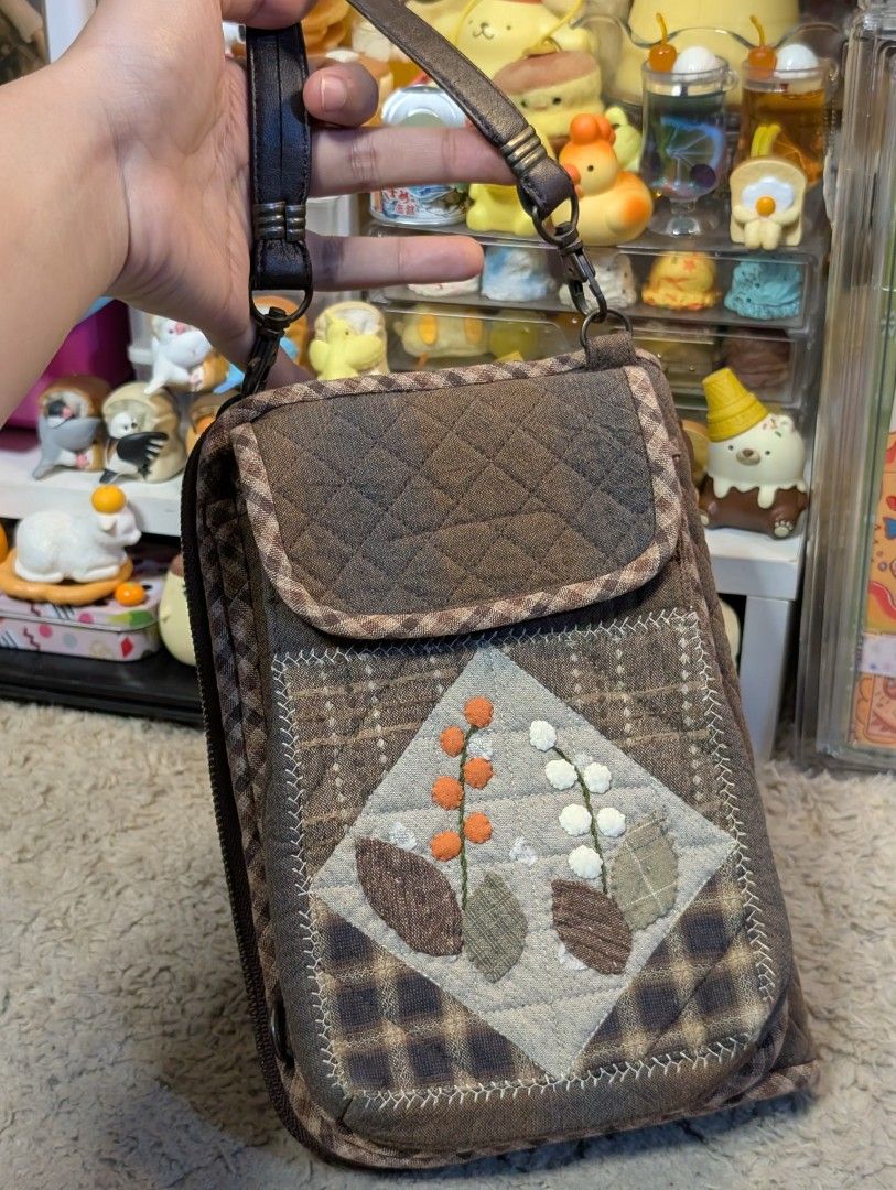 Japan Patchwork Handmadw Clutch Sling Bag (Category: Belt bags, Clutches and Pouches) located in San Pedro. Submitted by eurisilvers (Listing ID 1467973060, Image 1). Description: Has a lot of compartments, with card holders, can store cash and coins, a mini notebook, airpods etc. Convertible to sling bag aside from being a handbag or clutch. — shipping is via J&T Express — mop: gcash, maya, bank transfer — location: san pedro city, laguna.