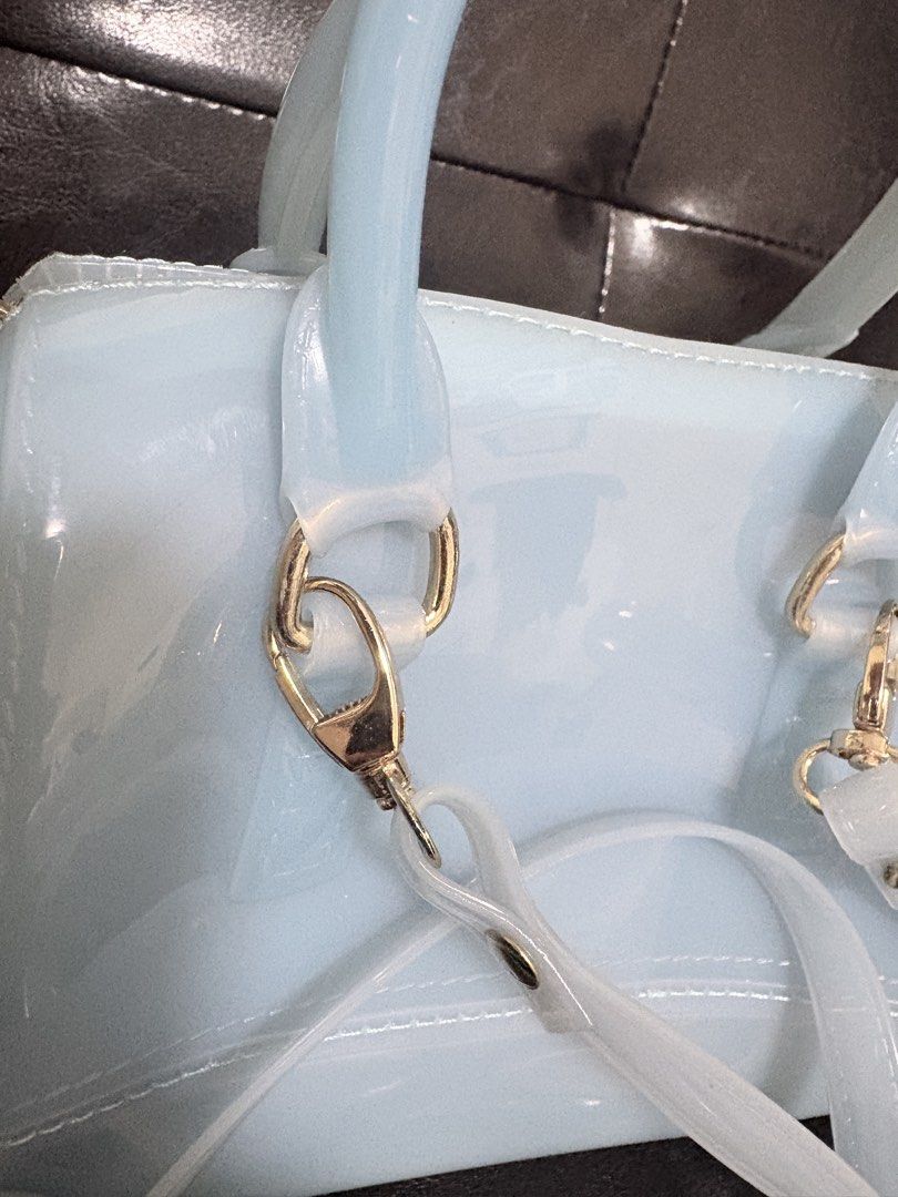 Jelly Handbag with Removable Strap (Category: Shoulder Bags) located in Quezon City. Submitted by viee04 (Listing ID 1467911015, Image 3). Description: - Color: Light blue - Material: Waterproof silicone (super easy to wipe clean) - Hardware: Gold-tone with top zipper closure - Features: Top handles and matching adjustable/detachable shoulder strap - Size: Compact, ideal for daily essentials, phone, and keys From Thailand bought for 1600php May k