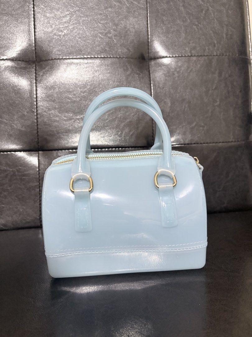 Jelly Handbag with Removable Strap (Category: Shoulder Bags) located in Quezon City. Submitted by viee04 (Listing ID 1467911015, Image 1). Description: - Color: Light blue - Material: Waterproof silicone (super easy to wipe clean) - Hardware: Gold-tone with top zipper closure - Features: Top handles and matching adjustable/detachable shoulder strap - Size: Compact, ideal for daily essentials, phone, and keys From Thailand bought for 1600php May k