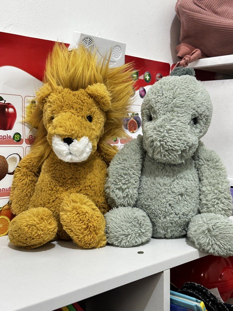 Jellycat Bundle — Bashful Lion and Puffles Dino (Category: Plushies & Soft Toys) located in Cabanatuan. Submitted by tinytreasuretales (Listing ID 1467873166, Image 1). Description: - Set of 2 plush toys: Fluffy yellow lion and sage green donkey - Condition: Clean and very fluffy - Ideal for kids, gifts, or toy collectors - Selling both together as a bundle.