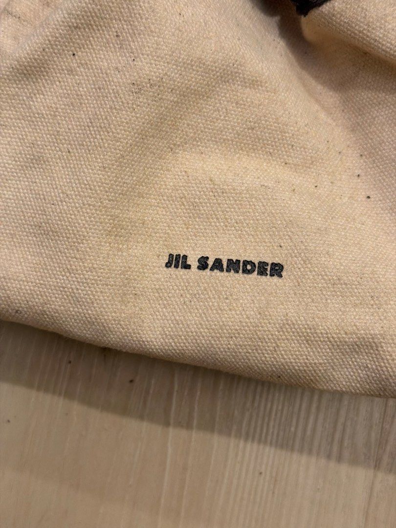 Jil Sander Canvas and Leather Drawstring Crossbody Bag (Category: Cross-body Bags) located in Manila. Submitted by _____car0usell (Listing ID 1467984455, Image 2). Description: Includes dust bag Notable flaking and peeling along the black leather drawstring collar.