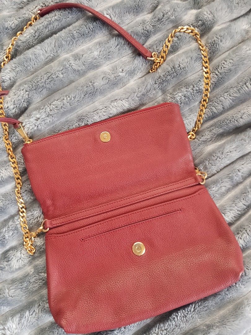 Jill Stuart Red Leather Chain Crossbody Bag (Category: Cross-body Bags) located in Zamboanga. Submitted by reg_ukay_shopp (Listing ID 1467851051, Image 3). Description: - Brand: Jill Stuart - Material: Rich red pebbled leather - Hardware: Gold-tone chunky chain strap with leather shoulder guard - Closure: Foldover flap with magnetic snap - Exterior: Convenient front zippered pocket - Interior: Clean lining with structured compartments - Condition