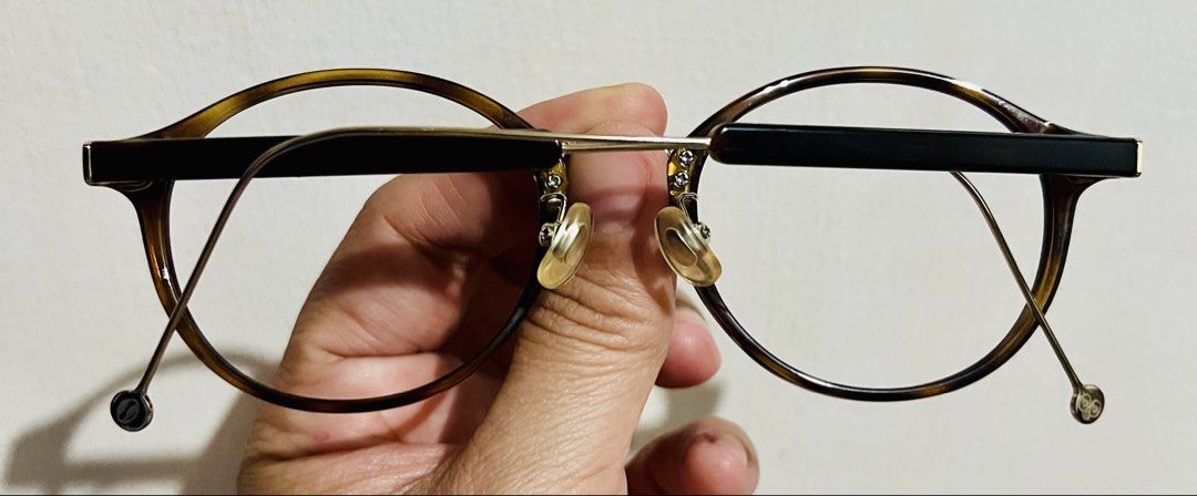 JINS X Doraemon Eyeglasses (Category: Sunglasses & Eyewear) located in Bacoor. Submitted by faith.hope.love28 (Listing ID 1467921788, Image 3). Description: - Brand: JINS Switch x Doraemon - Model: URF-23S-011 186 - Size: 49-20-150 - Frame: Tortoise shell with blue temple arms - Special Details: Temple tips inspired by Doraemon's tail and hands, plus secret gadget engravings - Inclusions: Matching blue leather case and comic strip cleaning cloth 