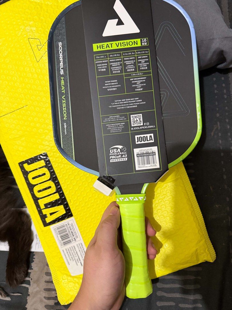 JOOLA Scorpeus Heat Vision 16mm Pickleball Paddle (Category: Racket and Ball Sports) located in Dasmarinas. Submitted by dekvance (Listing ID 1468058430, Image 1). Description: - Model: JOOLA Scorpeus Heat Vision (16mm thickness) - Condition: Like new with original cardboard hangtags and barcode sticker attached - Endorsement: Ben Johns signature hybrid paddle for power and control - Dimensions: 16" length, 8" width, 7.8oz average weight - Grip: 