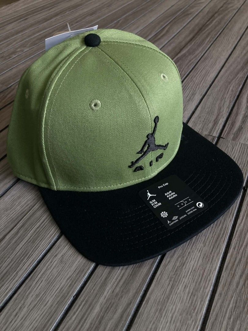 Jordan Pro Cap Olive Green Black Snapback (Category: Caps & Hats) located in Trece Martires City. Submitted by djaothriftshop (Listing ID 1467886982, Image 1). Description: - Authentic Jordan Pro snapback cap - Color: Olive green and black - Iconic embroidered Jumpman Air logo on the front - Flat brim style with store tags still attached - Adjustable back closure for a custom fit - Size: S/M adult fit - Interior branded taping with Jordan quote.