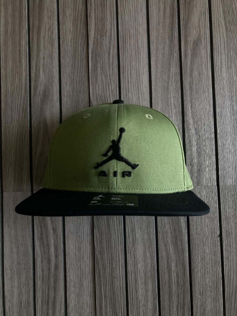 Jordan Pro Cap Olive Green Black Snapback (Category: Caps & Hats) located in Trece Martires City. Submitted by djaothriftshop (Listing ID 1467886982, Image 2). Description: - Authentic Jordan Pro snapback cap - Color: Olive green and black - Iconic embroidered Jumpman Air logo on the front - Flat brim style with store tags still attached - Adjustable back closure for a custom fit - Size: S/M adult fit - Interior branded taping with Jordan quote.