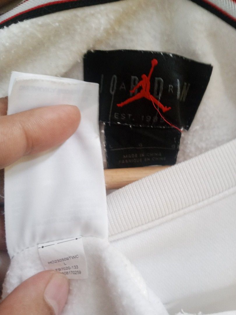 Jordan White Sweatshirt Large (Category: Coats, Jackets and Outerwear) located in Santa Rosa. Submitted by thethriftersshop (Listing ID 1467870165, Image 3). Description: - Item: White Jordan Sweatshirt - Size: L - Width 23 Length 28 - Design: Small embroidered Jumpman logo on chest, large printed JORDAN lettering on back - Condition: Good, with slight fraying wear visible at the wrist edges,Yellow Stain Need Wash - Details: Interior tag intact (