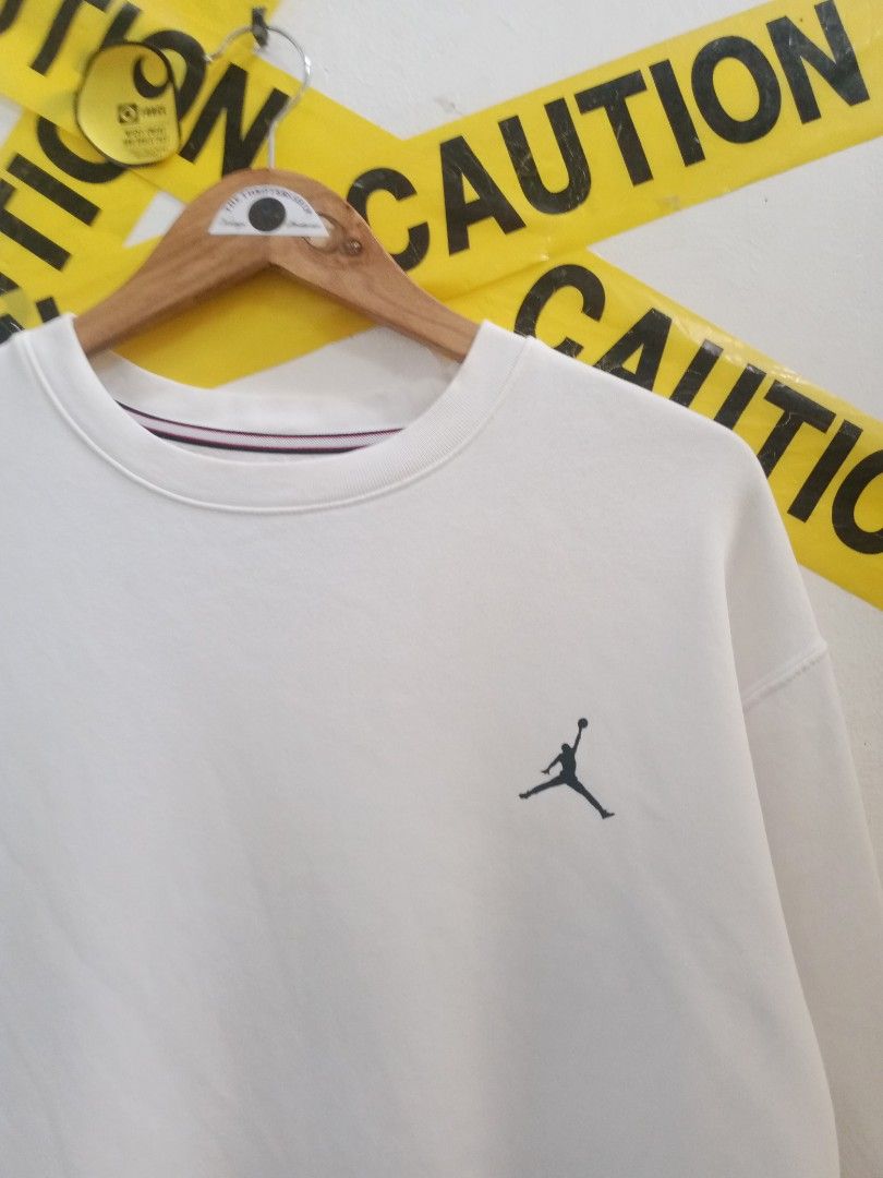 Jordan White Sweatshirt Large (Category: Coats, Jackets and Outerwear) located in Santa Rosa. Submitted by thethriftersshop (Listing ID 1467870165, Image 2). Description: - Item: White Jordan Sweatshirt - Size: L - Width 23 Length 28 - Design: Small embroidered Jumpman logo on chest, large printed JORDAN lettering on back - Condition: Good, with slight fraying wear visible at the wrist edges,Yellow Stain Need Wash - Details: Interior tag intact (