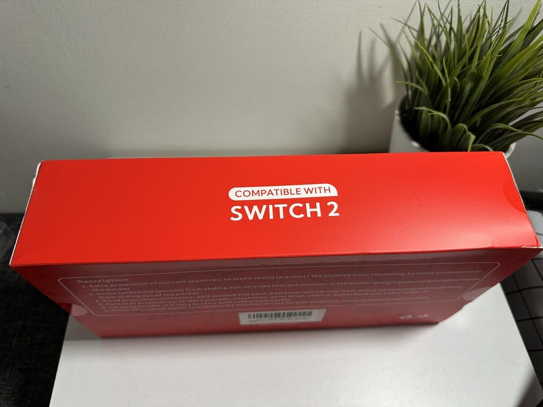 JOYLINK Travel Case Compatible with Nintendo Switch 2 OLED Switch (Category: Cases & Covers) located in Cabanatuan. Submitted by s.kit.27 (Listing ID 1468017529, Image 2). Description: - Compatible with Nintendo Switch 2 and Switch OLED models - Tough molded hard shell exterior safeguards against drops and bumps - Secure interior card slots prevent game cards from sliding - Built-in mesh pocket for joycons, earphones, and cables - Durable, waterp