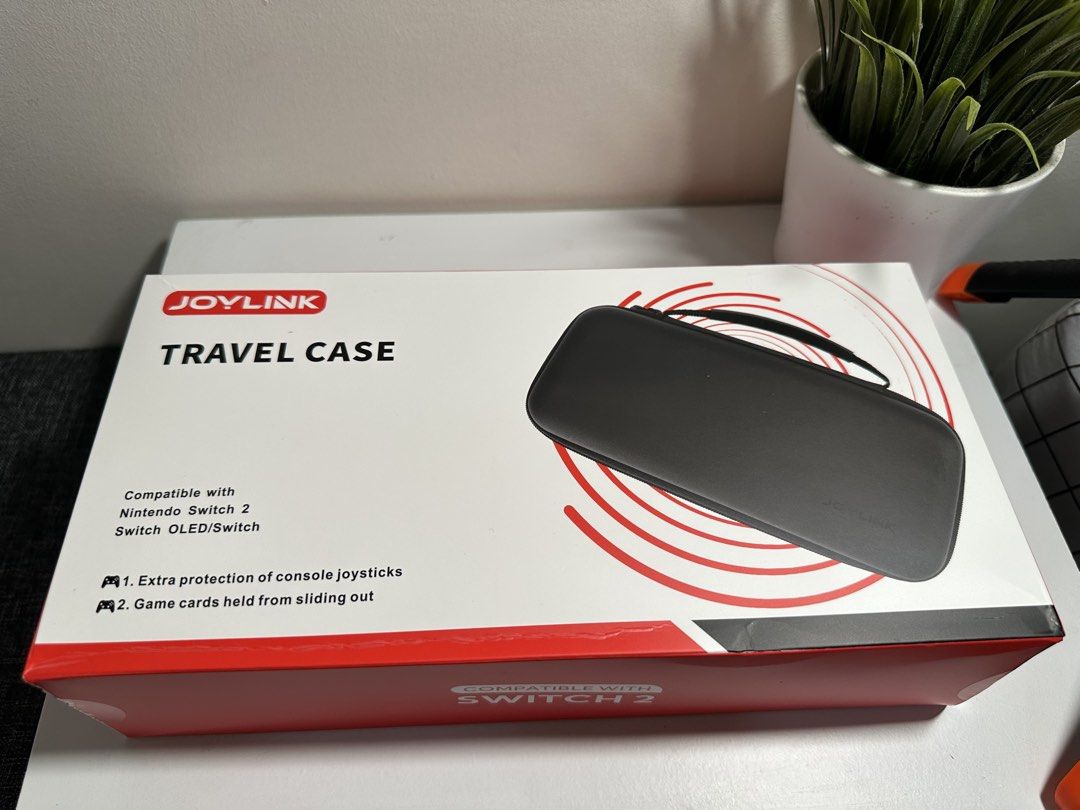 JOYLINK Travel Case Compatible with Nintendo Switch 2 OLED Switch (Category: Cases & Covers) located in Cabanatuan. Submitted by s.kit.27 (Listing ID 1468017529, Image 1). Description: - Compatible with Nintendo Switch 2 and Switch OLED models - Tough molded hard shell exterior safeguards against drops and bumps - Secure interior card slots prevent game cards from sliding - Built-in mesh pocket for joycons, earphones, and cables - Durable, waterp