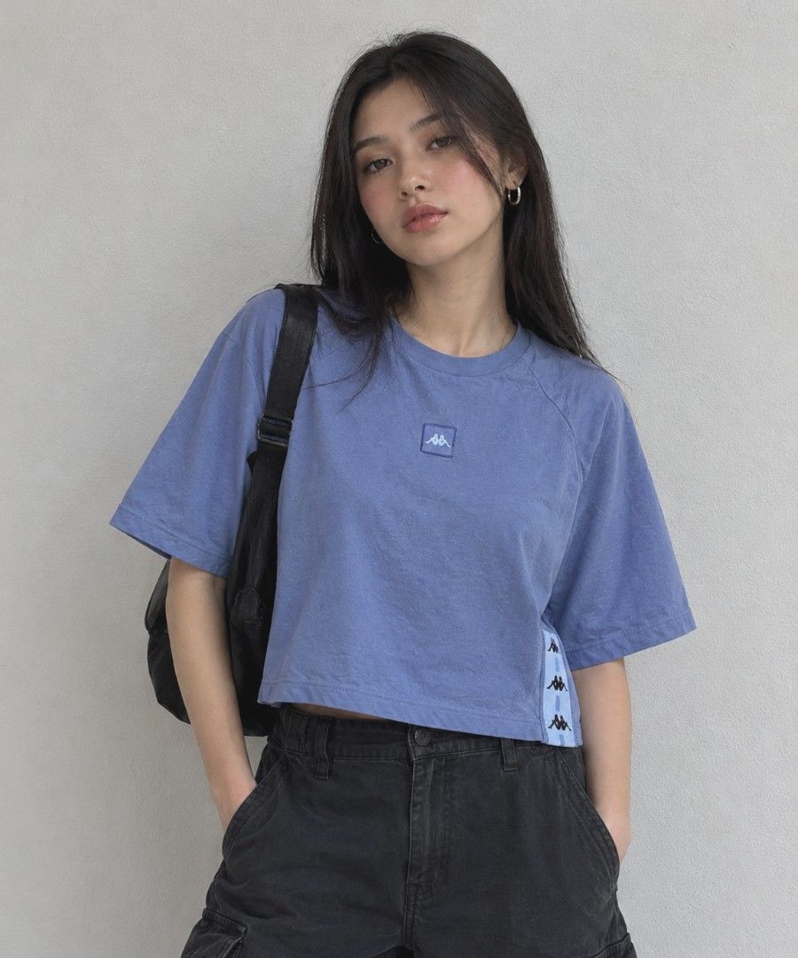 KAPPA CROPPED SHIRT (Category: Shirts) located in Manila. Submitted by friperie. (Listing ID 1467954193, Image 1). Description: KAPPA PERIWINKLE OVERSIZED CROPPED TEE 💙 A stylish Kappa cropped tee in a beautiful periwinkle shade, featuring a classic embroidered front logo patch and signature side tape detailing for a sporty, vintage streetwear look. ✨ Details: - Color: Periwinkle - Design: Oversized cropped fit - Front: Embroidered Kappa logo pa