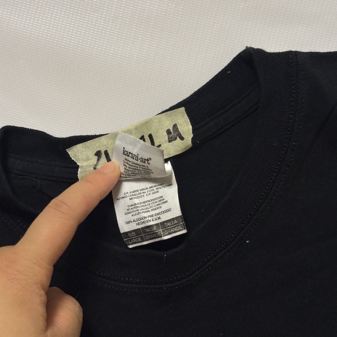 Karani Art Black Graphic Tee Shirt (Category: Formal Shirts) located in Gapan. Submitted by rasthriftshop17 (Listing ID 1467989892, Image 3). Description: Size on tag: L Dimes: 21 x 28 Condition: Excellent Color rate: 9/10 Issue: None.