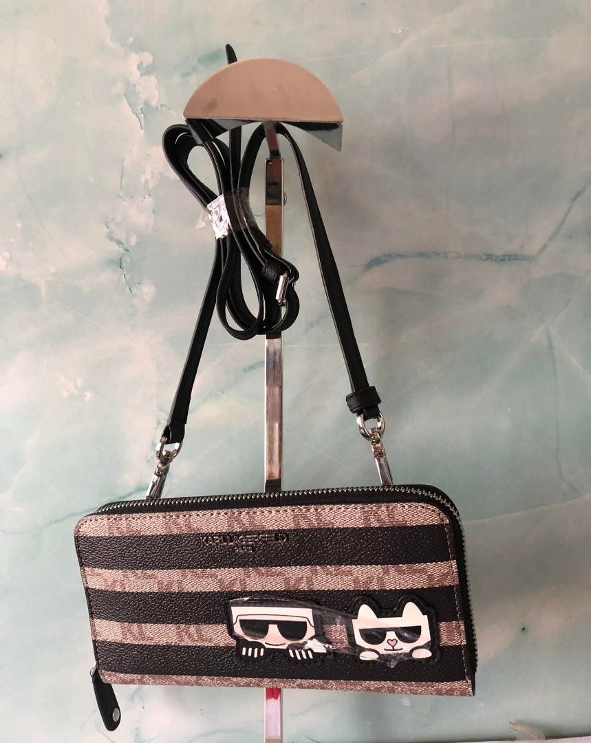KARL Lagerfeld wallet with sling (Category: Wallets & Card holders) located in Quezon City. Submitted by cmagday (Listing ID 1467941665, Image 1). Description: This is a Karl Lagerfeld Paris Wallet on a String / Crossbody Wallet featuring a tan-and-black striped monogram pattern with playful "K/Ikonik" Karl and Choupette character patches..