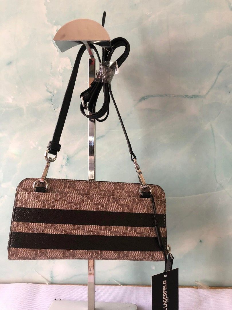 KARL Lagerfeld wallet with sling (Category: Wallets & Card holders) located in Quezon City. Submitted by cmagday (Listing ID 1467941665, Image 2). Description: This is a Karl Lagerfeld Paris Wallet on a String / Crossbody Wallet featuring a tan-and-black striped monogram pattern with playful "K/Ikonik" Karl and Choupette character patches..