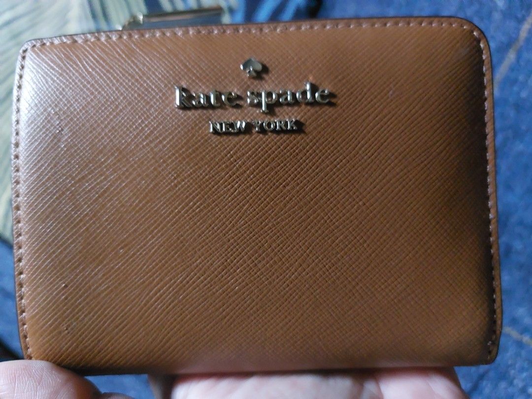 KATE SPADE BIFOLD WALLET IN BROWN (Category: Wallets & Card holders) located in Cebu City. Submitted by jamstore (Listing ID 1467875486, Image 1). Description: preloved no issue good as new 💯 original.