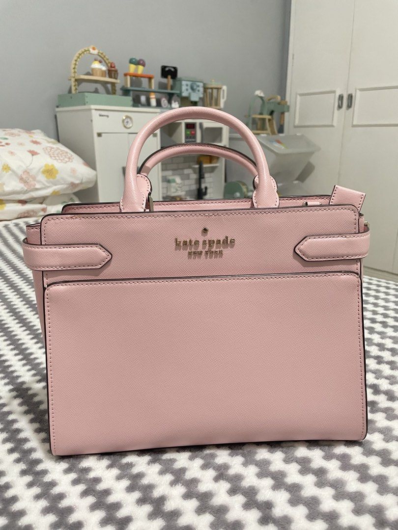 Kate spade medium satchel (Category: Clutches) located in Valenzuela. Submitted by 4kshoppe (Listing ID 1467977256, Image 1). Description: Original Color: chalk pink/light pink Dimensions: Approximately 8.62” high × 10.87” wide × 5” deep (with a 5.5” handle drop ) .