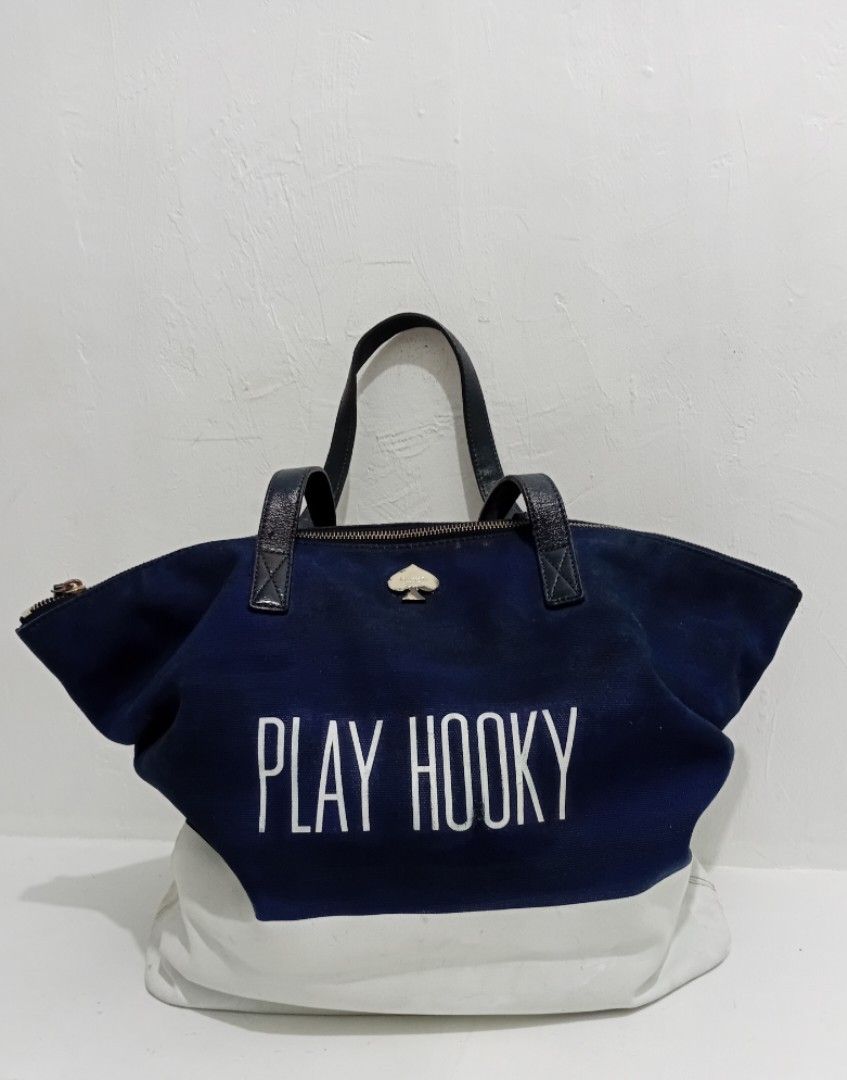 Kate Spade PLAY HOOKY XL TOTEBAG (Category: Luxury Bags & Wallets) located in Manila. Submitted by eriiicaspage (Listing ID 1467038887, Image 2). Description: PREOWNED Lightly Used Authentic Kate Spade Canvas Leather XL totebag - Color/Design: Navy blue and white canvas with 'PLAY HOOKY' print - Straps: Navy blue leather, - Hardware: Signature spade on top center - Closure: Top zip - Interior: Tan and white striped lining with 1 zippered pocket S