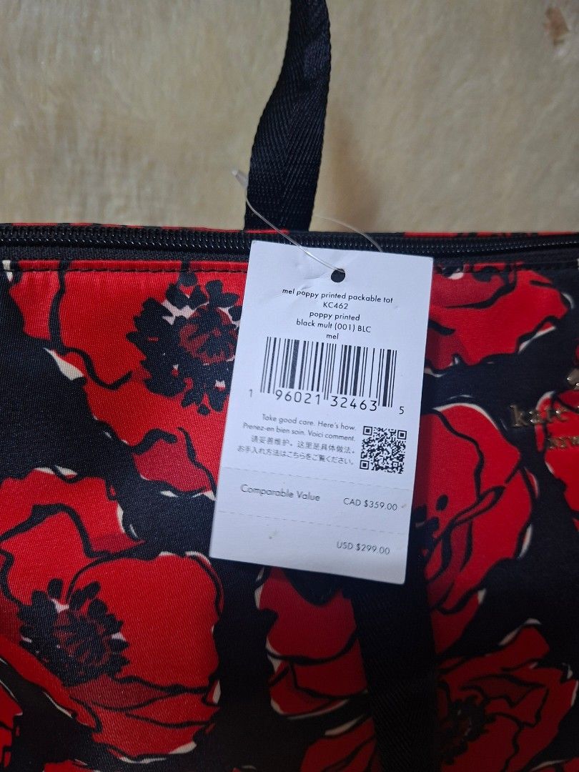 Kate Spade Poppy Printed Packable Tote (Category: Tote Bags) located in Manila. Submitted by yanakolekzione (Listing ID 1468054965, Image 3). Description: Kate Spade packable tote bag in black multi poppy print. Spacious design with sturdy black straps and top zip closure. Packs down into its own attached pouch for easy travel and storage. Original retail tag attached showing USD 299.00 value. Made in Philippines..