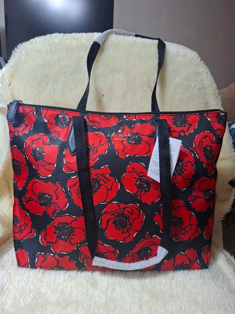 Kate Spade Poppy Printed Packable Tote (Category: Tote Bags) located in Manila. Submitted by yanakolekzione (Listing ID 1468054965, Image 1). Description: Kate Spade packable tote bag in black multi poppy print. Spacious design with sturdy black straps and top zip closure. Packs down into its own attached pouch for easy travel and storage. Original retail tag attached showing USD 299.00 value. Made in Philippines..