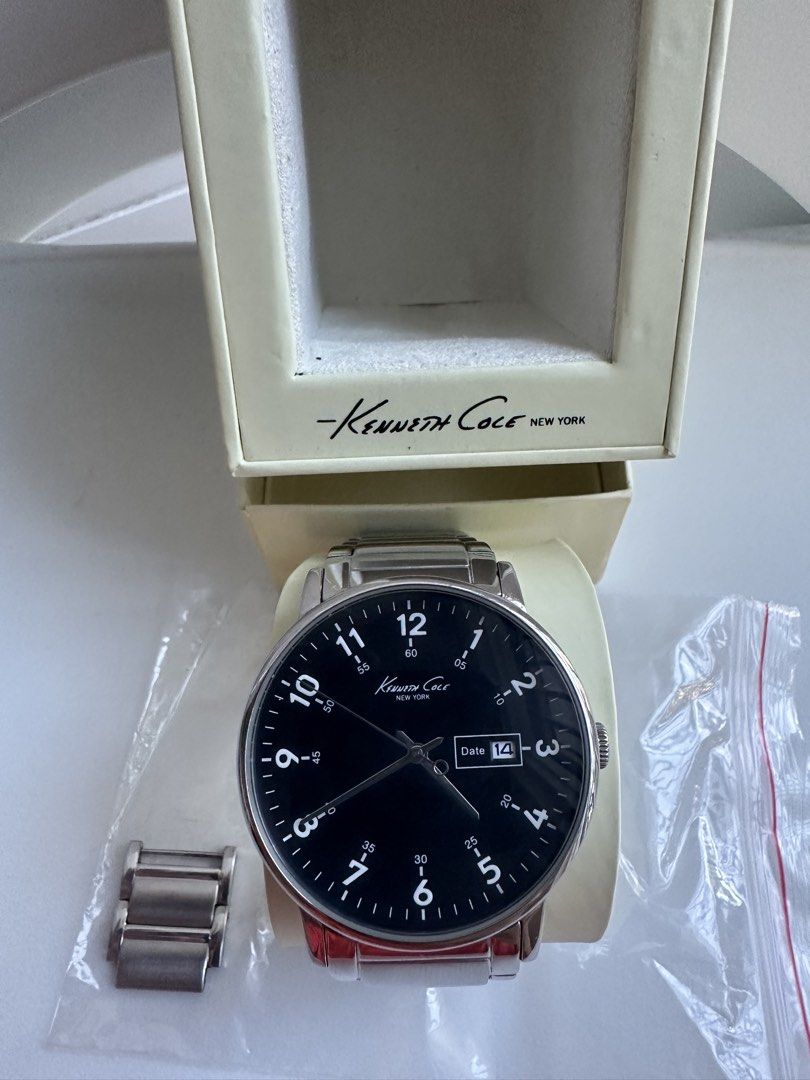 Kenneth Cole KC3869 (Category: Men's Watches) located in Manila. Submitted by daddy_athritis (Listing ID 1467928489, Image 2). Description: Model: KC3869 Kenneth Cole New York Color: Black Dial Stainless Steel Watch Silver-Tone hands. Silver bracelet. Condition: 1 visible scratch near the face and minor scratches in the bracelet Case Size: 42 mm diameter Water Resistance: Safe for accidental splashes,rain drops, or brief contact while washing you