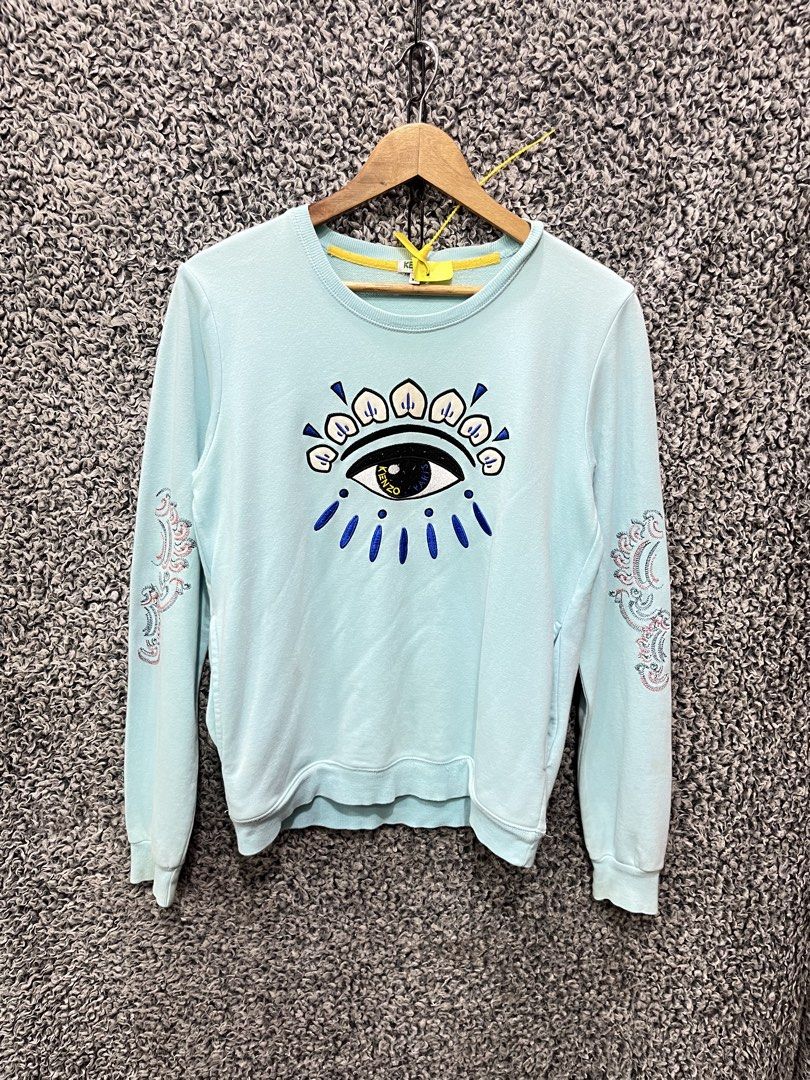 Kenzo light mint blue crew neck | Size S mens (Category: Tshirts & Polo Shirts ) located in General Trias. Submitted by zrchustle.604 (Listing ID 1468055656, Image 1). Description: Kenzo light mint blue crew neck sweatshirt featuring the brand's iconic embroidered All-Seeing Eye graphic on the chest. It includes detailed secondary embroidery motifs along both sleeves..