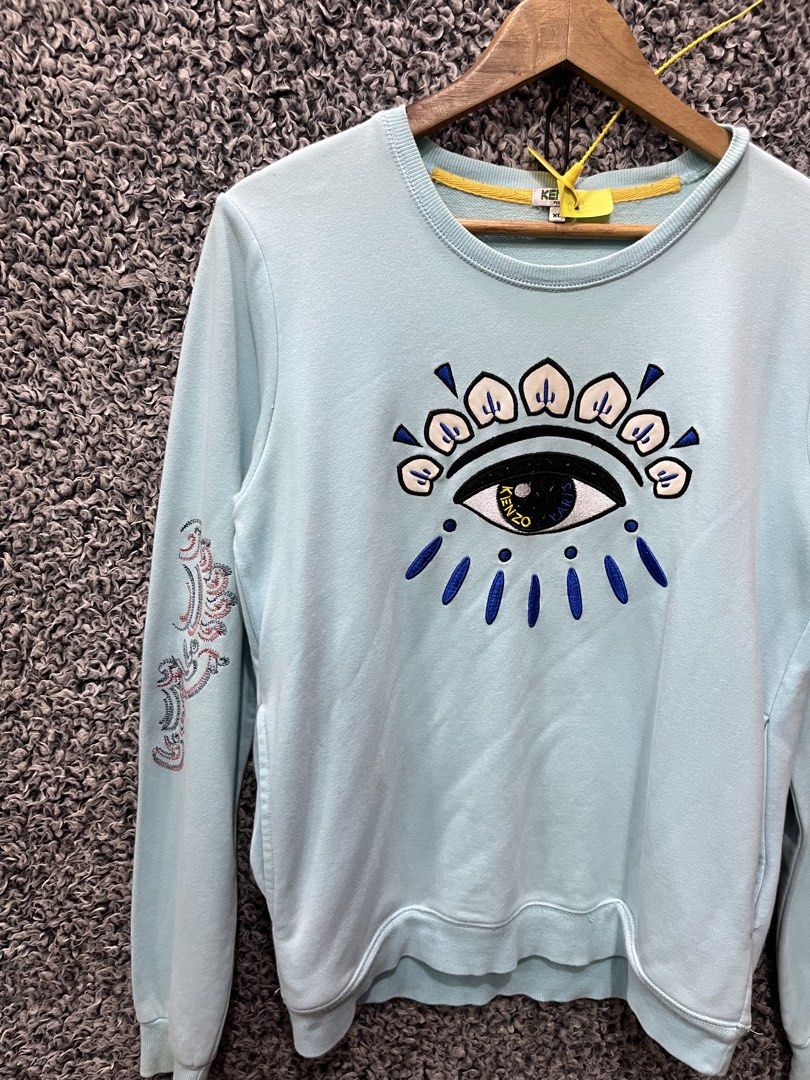Kenzo light mint blue crew neck | Size S mens (Category: Tshirts & Polo Shirts ) located in General Trias. Submitted by zrchustle.604 (Listing ID 1468055656, Image 2). Description: Kenzo light mint blue crew neck sweatshirt featuring the brand's iconic embroidered All-Seeing Eye graphic on the chest. It includes detailed secondary embroidery motifs along both sleeves..