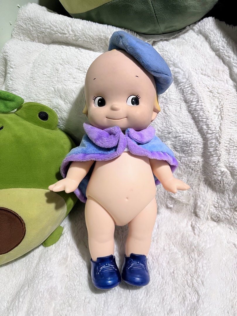 Kewpie Oike ‘11 (Category: Figurines & Statues) located in Zamboanga. Submitted by wilthearey91043 (Listing ID 1467982371, Image 1). Description: - Item: Sonny Angel Hippers Large Vinyl Doll - Outfit: Blue beret hat, fuzzy blue & purple mini cape, and matching blue shoes - Features: Adorable yellow hair tuft and small white wings on the back - Condition: Clean, excellent collector's shape - Status: Ready to ship / for a new home.