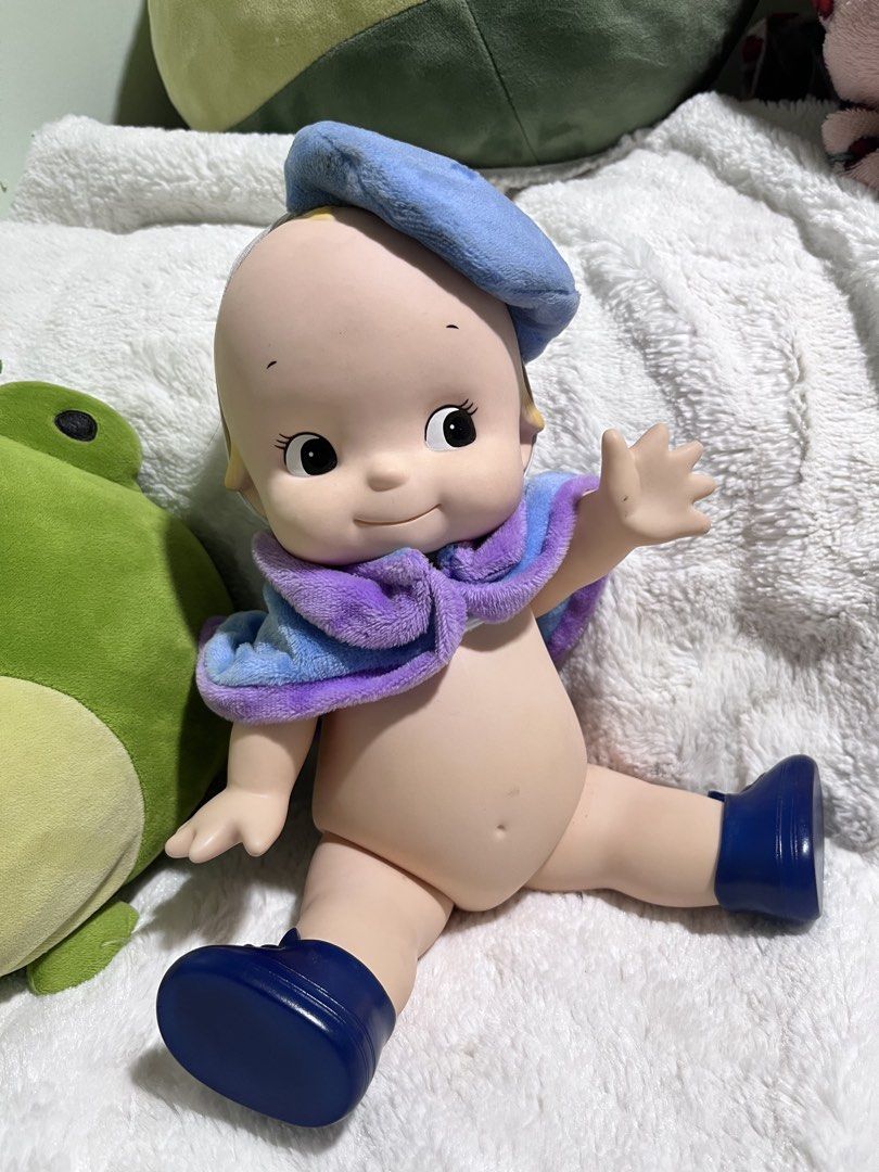 Kewpie Oike ‘11 (Category: Figurines & Statues) located in Zamboanga. Submitted by wilthearey91043 (Listing ID 1467982371, Image 2). Description: - Item: Sonny Angel Hippers Large Vinyl Doll - Outfit: Blue beret hat, fuzzy blue & purple mini cape, and matching blue shoes - Features: Adorable yellow hair tuft and small white wings on the back - Condition: Clean, excellent collector's shape - Status: Ready to ship / for a new home.