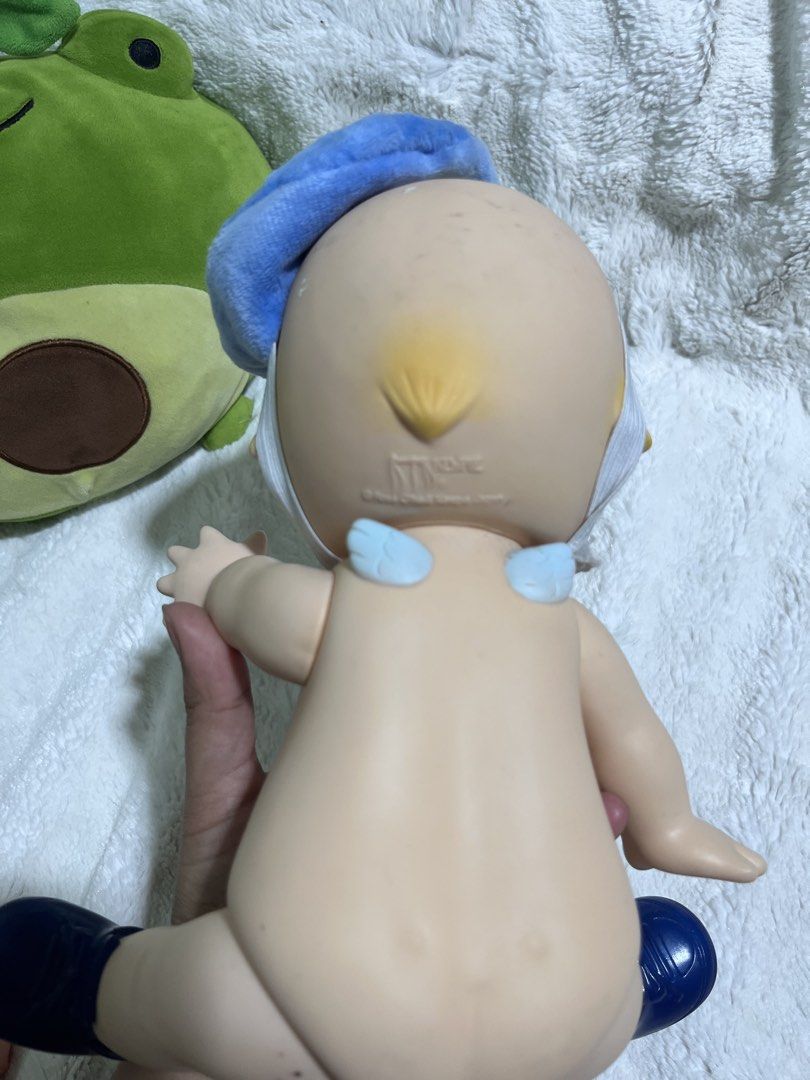 Kewpie Oike ‘11 (Category: Figurines & Statues) located in Zamboanga. Submitted by wilthearey91043 (Listing ID 1467982371, Image 3). Description: - Item: Sonny Angel Hippers Large Vinyl Doll - Outfit: Blue beret hat, fuzzy blue & purple mini cape, and matching blue shoes - Features: Adorable yellow hair tuft and small white wings on the back - Condition: Clean, excellent collector's shape - Status: Ready to ship / for a new home.