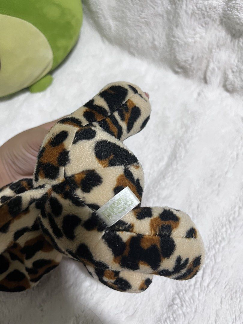 Kewpie Tokyo Mimore Doll (Category: Plushies & Soft Toys) located in Zamboanga. Submitted by wilthearey91043 (Listing ID 1467982367, Image 3). Description: - Brand: Tokyo Mimore - Design: Plush doll with a vinyl bald head and soft leopard print body - Features: Hood with animal ears, fuzzy white chest patch, and molded hair detail at the back - Condition: Pre-loved, well-maintained with intact brand tag - Origin: Made in China.