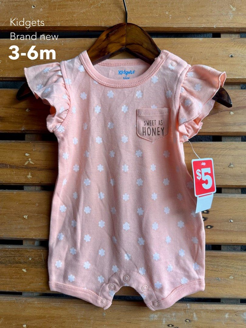Kidgets Baby Girl Rompers (Category: Babies & Kids Fashion) located in Santa Rosa. Submitted by yasss23 (Listing ID 1467982441, Image 1). Description: - Brand: Kidgets - Item: Bundle of baby girl rompers - Designs: Assorted cute prints (flowers, hearts, leopard print) - Features: Short sleeves, ruffled shoulders, snap buttons for easy diaper changes - Material: Soft and comfortable cotton, ideal for everyday wear - Sizes: Ranges from 0-3 months u