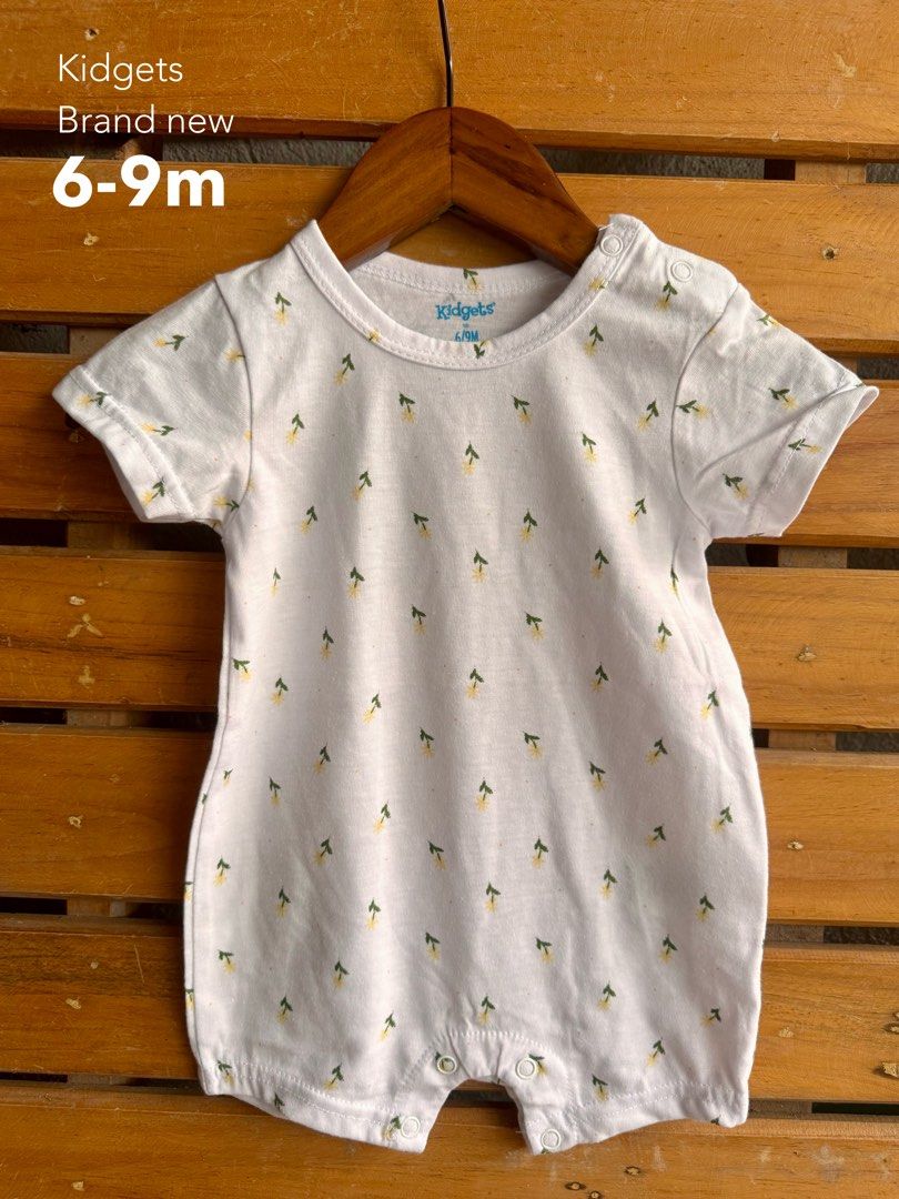 Kidgets Baby Girl Rompers (Category: Babies & Kids Fashion) located in Santa Rosa. Submitted by yasss23 (Listing ID 1467982441, Image 2). Description: - Brand: Kidgets - Item: Bundle of baby girl rompers - Designs: Assorted cute prints (flowers, hearts, leopard print) - Features: Short sleeves, ruffled shoulders, snap buttons for easy diaper changes - Material: Soft and comfortable cotton, ideal for everyday wear - Sizes: Ranges from 0-3 months u