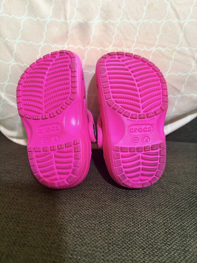 Kids Pink Minnie Mouse Crocs Size C4 (Category: Babies & Kids Fashion) located in Quezon City. Submitted by pattycloset08 (Listing ID 1467893274, Image 2). Description: - Size: C4 (tamped on the bottom) - Color: Bright pink - Features: Minnie Mouse Jibbitz charms included - Design: Slip-on style with secure heel straps - Condition: Soles have tread patterns with minor wear from previous use - Perfect for: Little Disney fans and everyday fun wear 