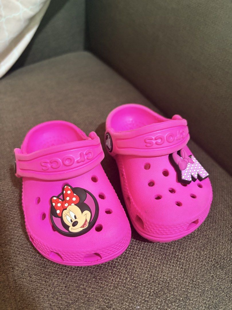 Kids Pink Minnie Mouse Crocs Size C4 (Category: Babies & Kids Fashion) located in Quezon City. Submitted by pattycloset08 (Listing ID 1467893274, Image 1). Description: - Size: C4 (tamped on the bottom) - Color: Bright pink - Features: Minnie Mouse Jibbitz charms included - Design: Slip-on style with secure heel straps - Condition: Soles have tread patterns with minor wear from previous use - Perfect for: Little Disney fans and everyday fun wear 